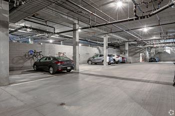 a parking garage with cars parked in it